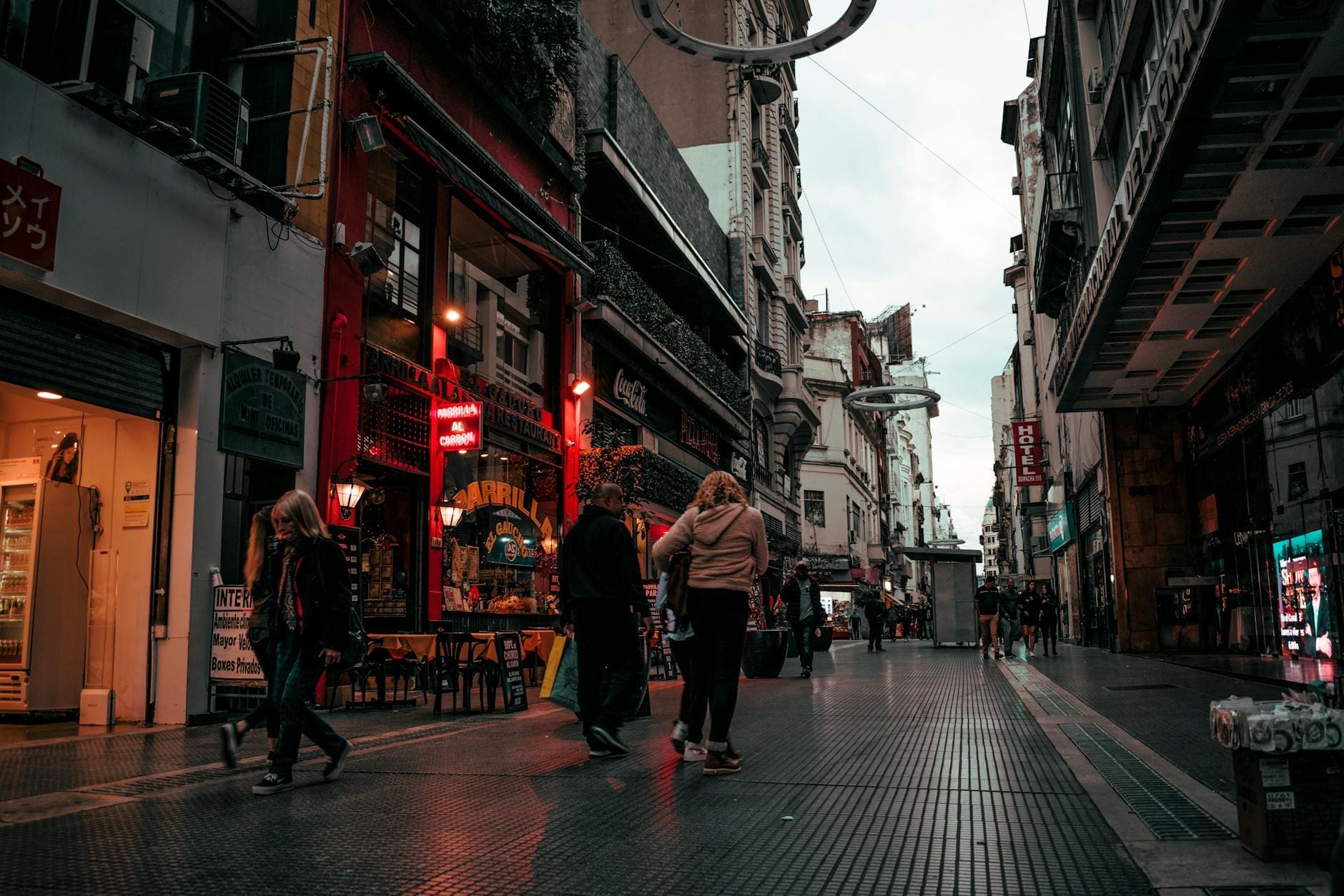 people walking on alley near buildings